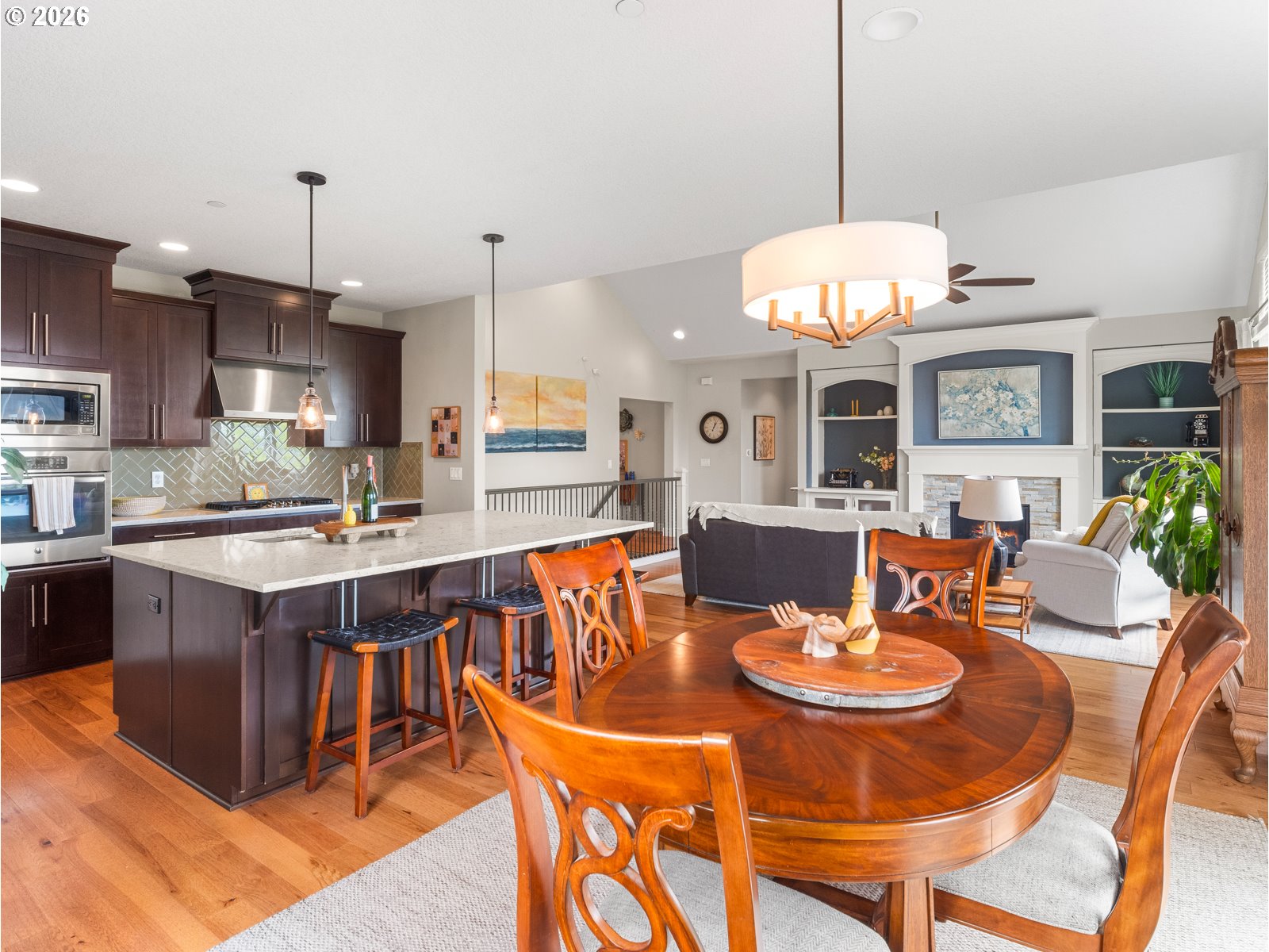 1420 Northwest Goodwin Street Camas, WA 98607 - Photo 20 of 48 a kitchen with a dining table and chairs