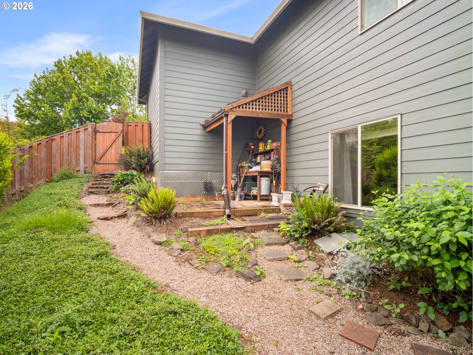1420 Northwest Goodwin Street Camas, WA 98607 - Photo 45 of 48 a front view of a house with a yard and a garden