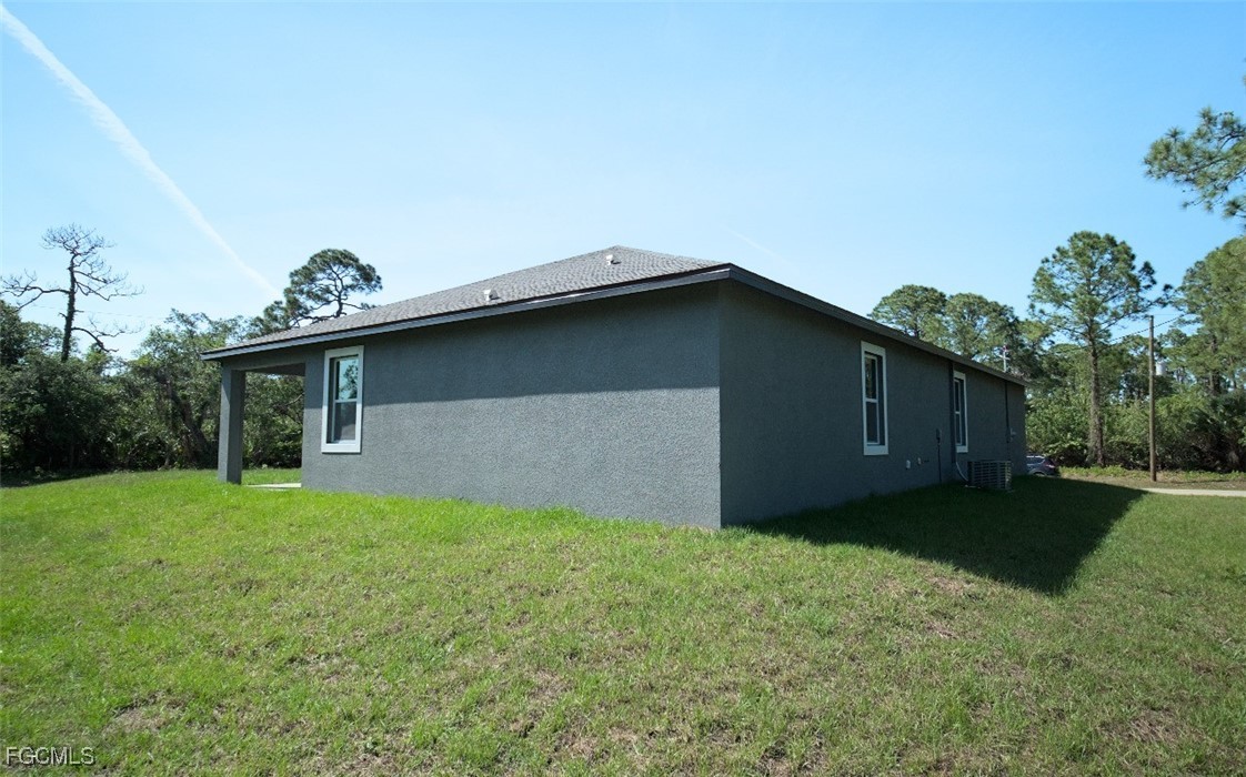3059 Harvard Circle LaBelle, FL 33935 - Photo 2 of 10 a house with a yard
