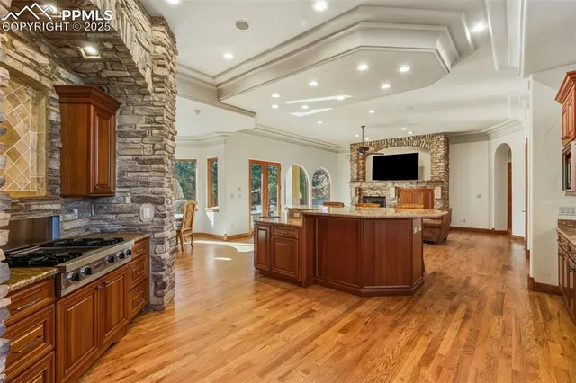 a kitchen with a sink appliances and cabinets