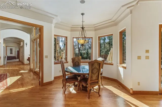 a dining room with furniture window wooden floor