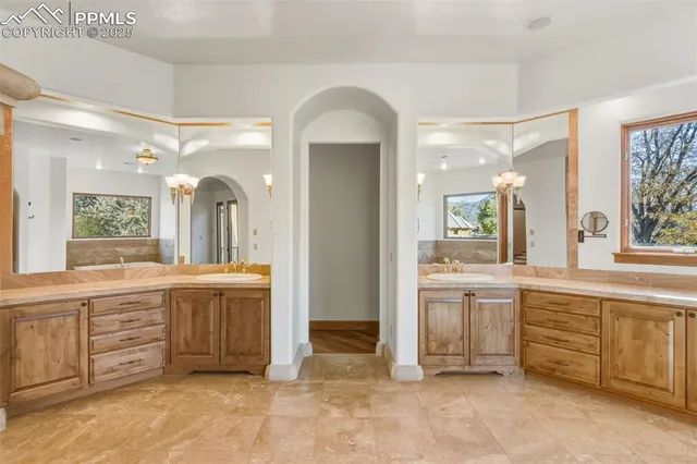 a large bathroom with a large tub and sink