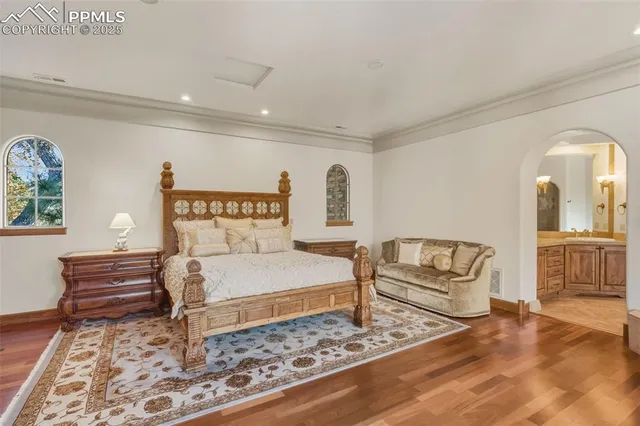 a bedroom with a bed and a couch