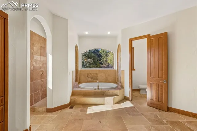 a living room with a large window and a table