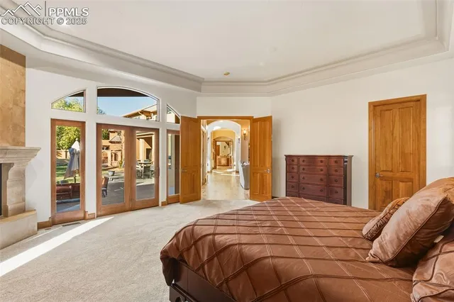 a bedroom with a large bed and a large window