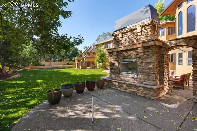 a view of a chairs in backyard of the house