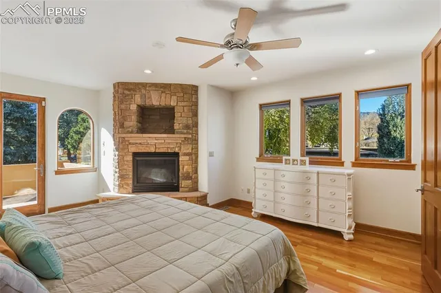 a bedroom with a large bed and a large window