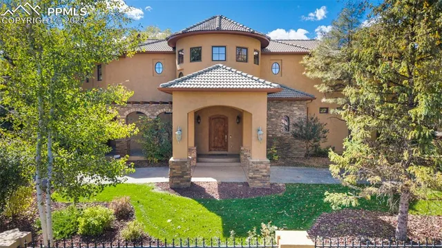 a front view of a house with garden