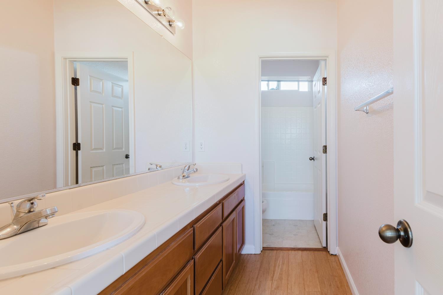10628 Hidden Grove Circle Stockton, CA 95209 - Photo 23 of 41 a bathroom with a sink and a mirror