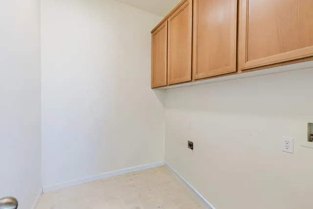 an empty room with wooden floor