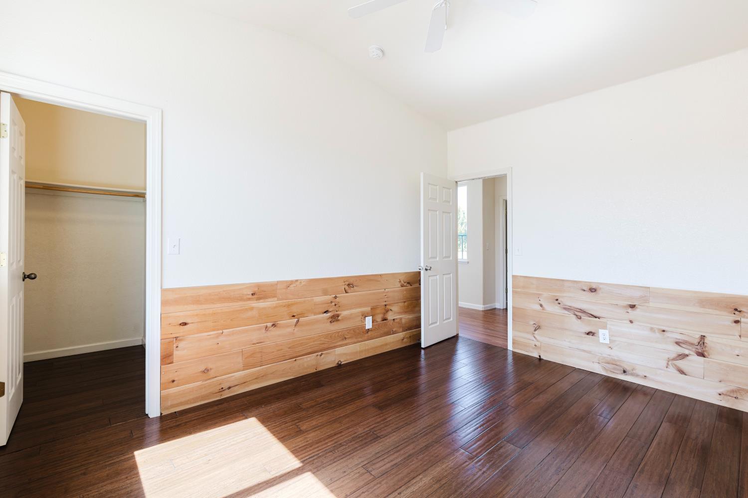 10628 Hidden Grove Circle Stockton, CA 95209 - Photo 26 of 41 an empty room with wooden floor