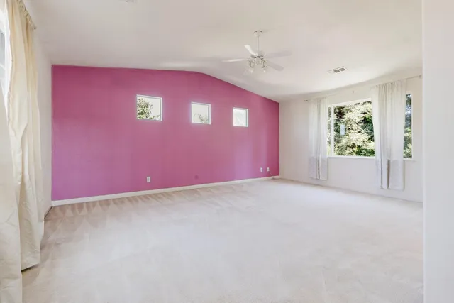a view of an empty room with a bathroom