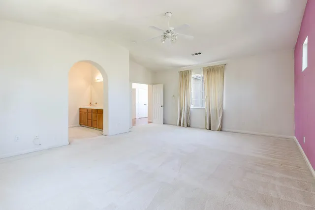 a bathroom with a double vanity sink and a bathtub