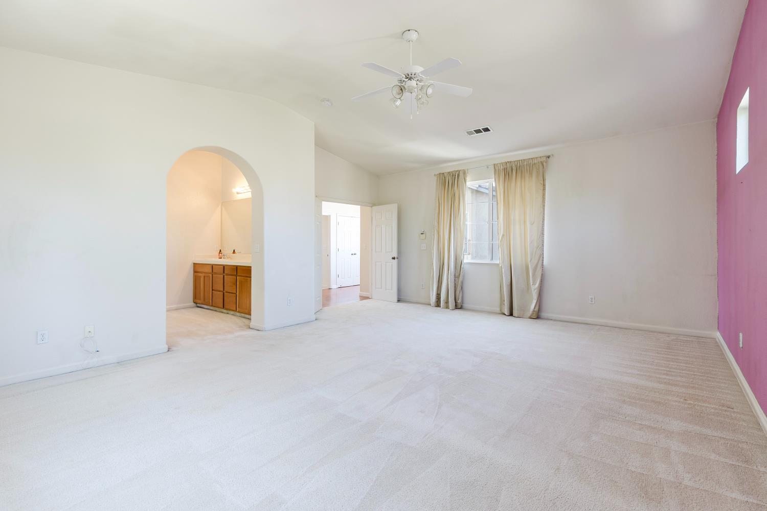 10628 Hidden Grove Circle Stockton, CA 95209 - Photo 29 of 41 a view of an empty room with a bathroom
