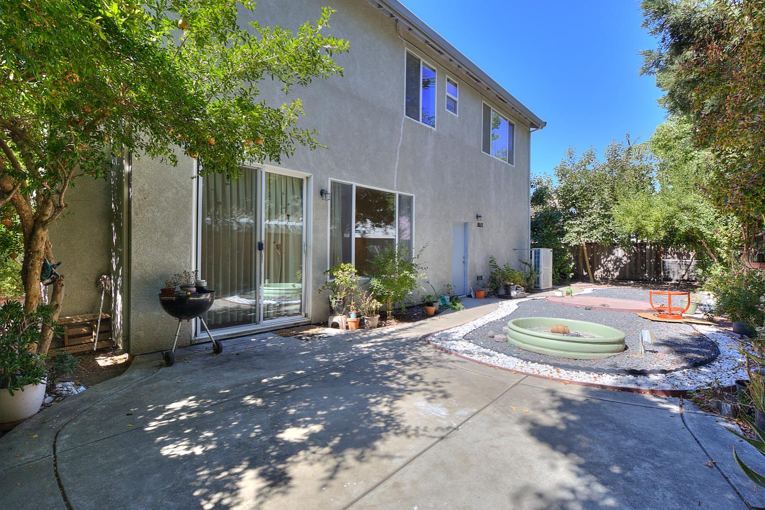 10628 Hidden Grove Circle Stockton, CA 95209 - Photo 35 of 41 a front view of a house with a yard