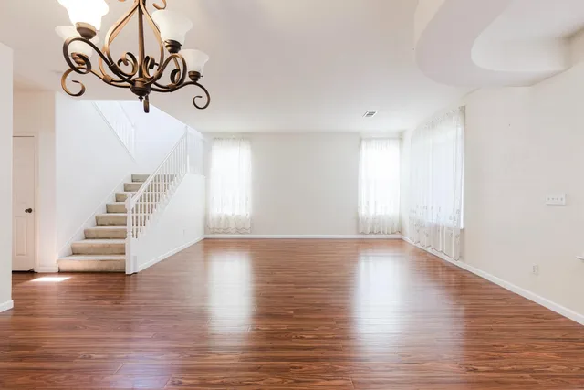 a view of an entryway with wooden floor