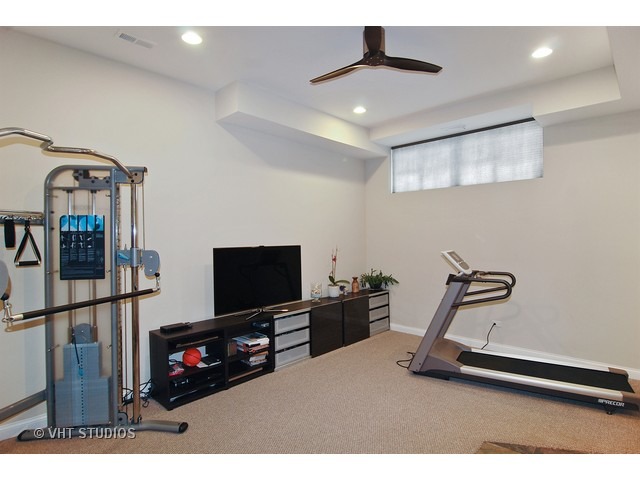 21 North Herbert Road, Unit F Riverside, IL 60546 - Photo 8 of 21 a living room with furniture and a flat screen tv