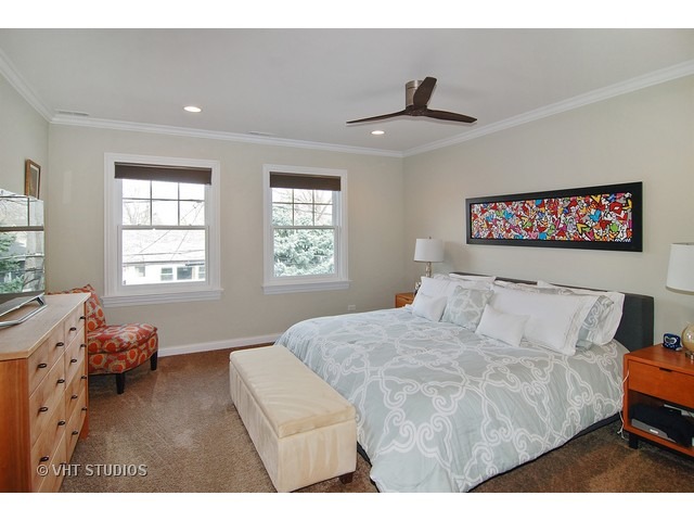 21 North Herbert Road, Unit F Riverside, IL 60546 - Photo 9 of 21 a bedroom with a bed and wooden floor