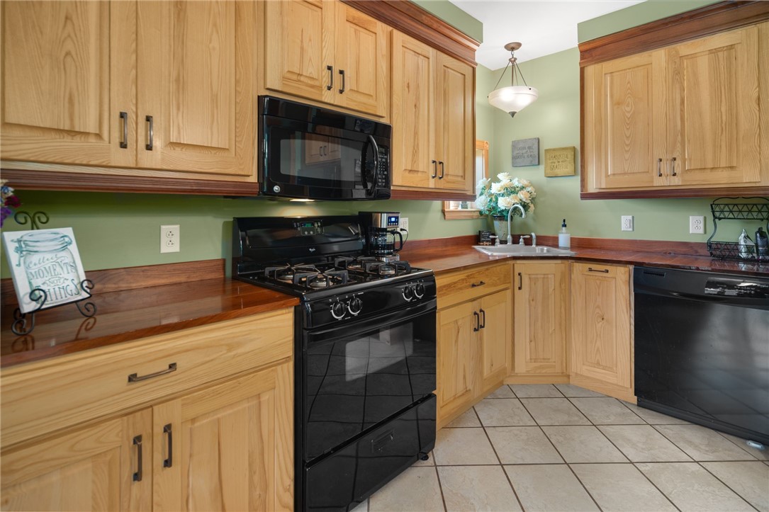 5903 Howell Road Locke, NY 13092 - Photo 13 of 44 Spacious kitchen with custom cabinetry and striking walnut countertops