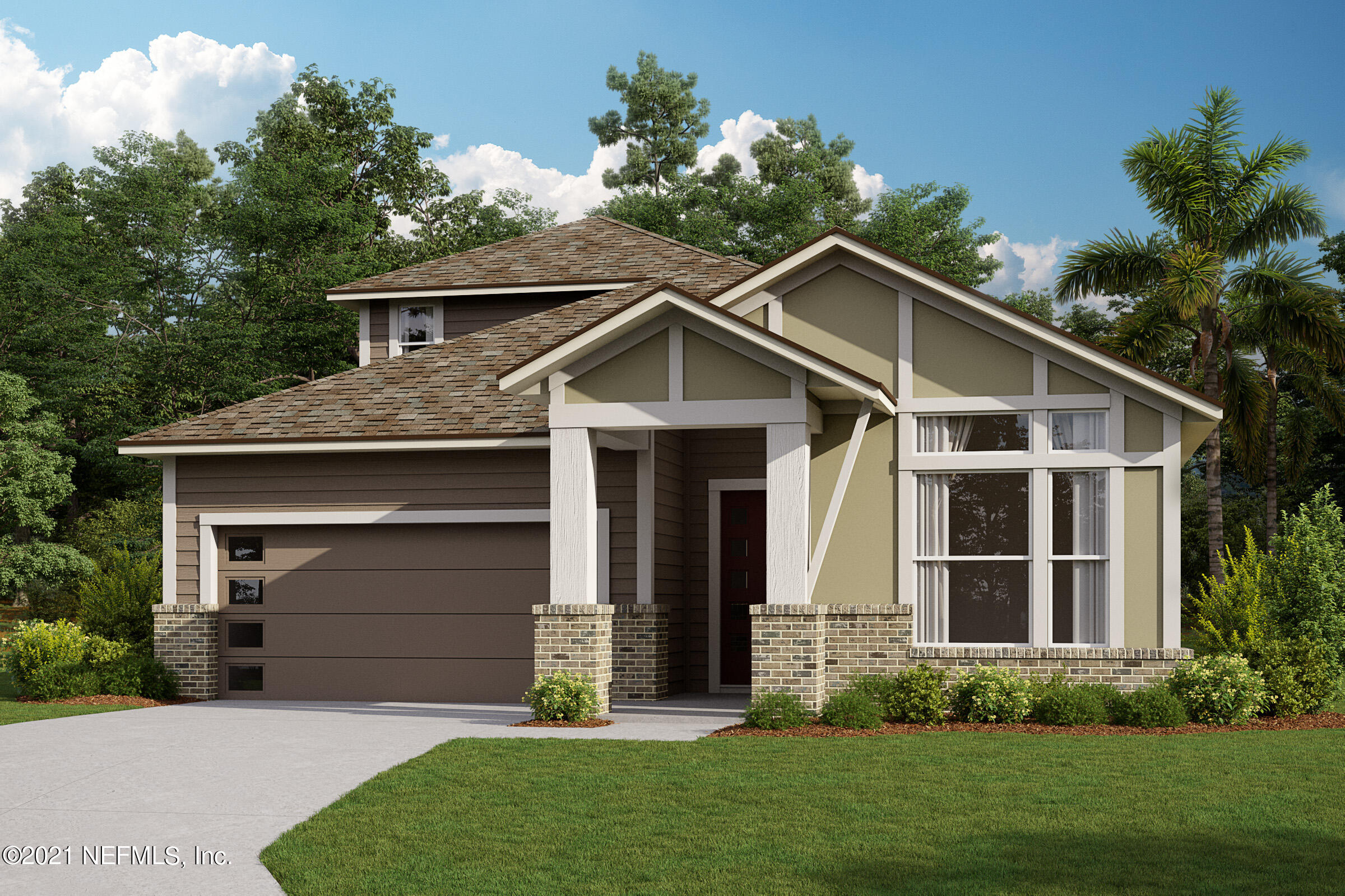 a front view of a house with a garden and yard