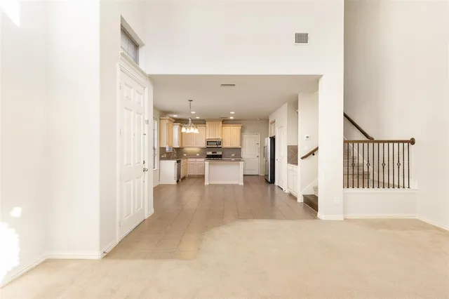 a view of a kitchen with furniture and floor to ceiling window