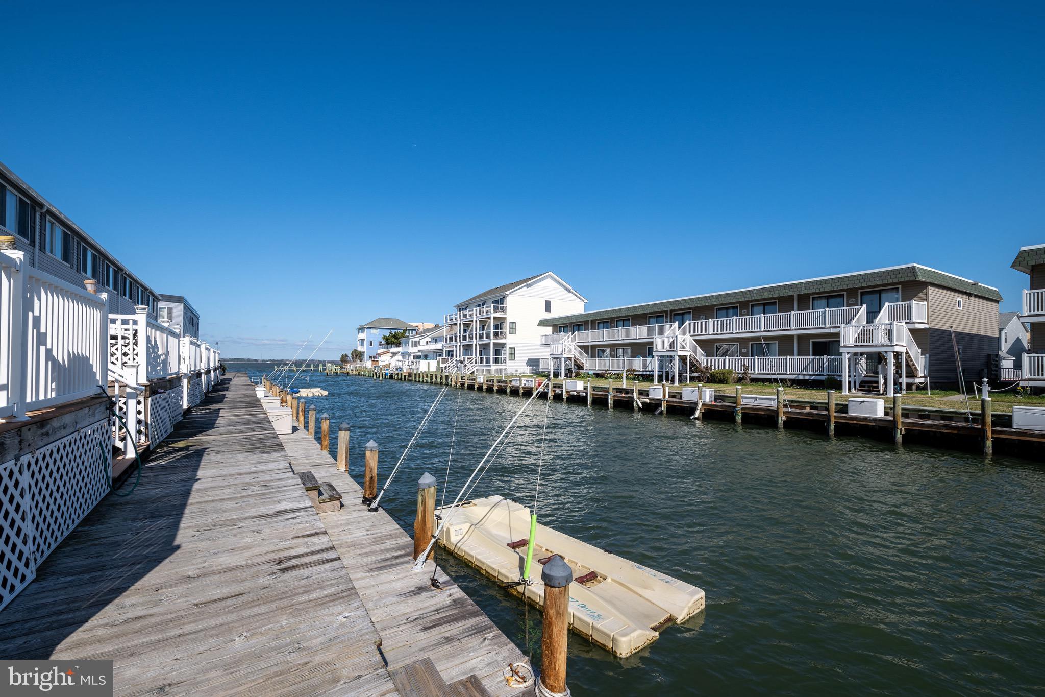 720 Rusty Anchor Road, Unit 41C Ocean City, MD 21842 - Photo 15 of 32 a balcony with wooden floors and lake view