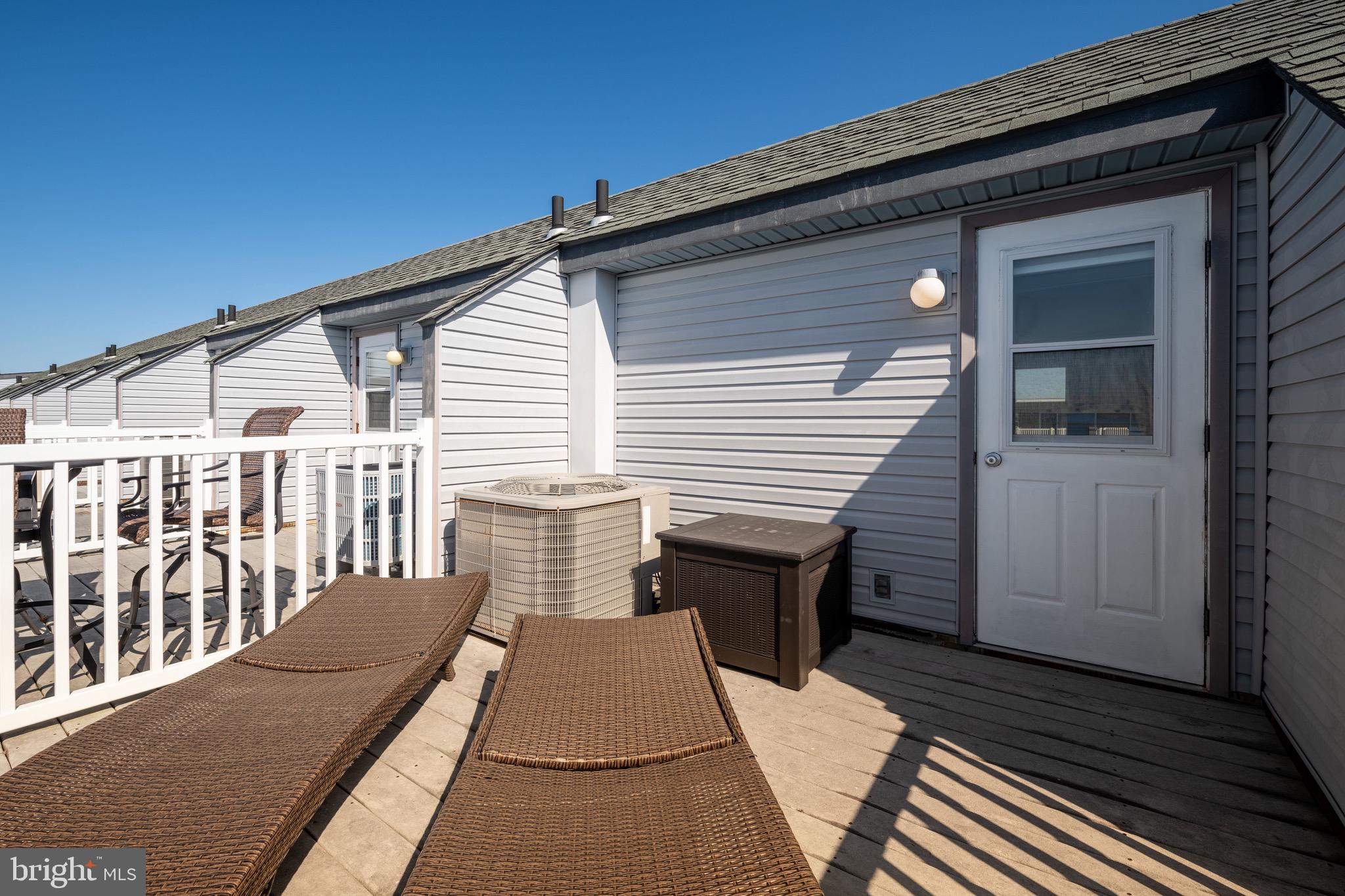 720 Rusty Anchor Road, Unit 41C Ocean City, MD 21842 - Photo 24 of 32 a view of a house with a deck