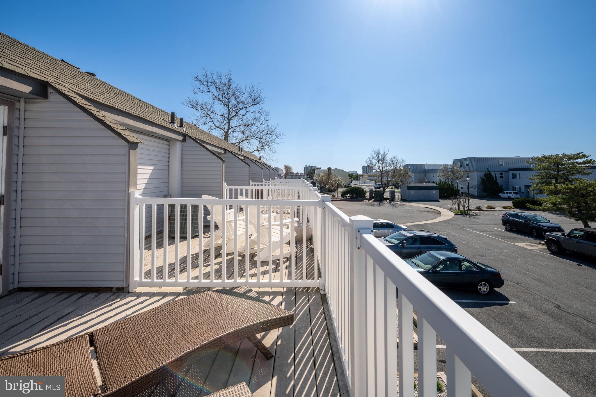 720 Rusty Anchor Road, Unit 41C Ocean City, MD 21842 - Photo 25 of 32 a view of a patio with wooden fence