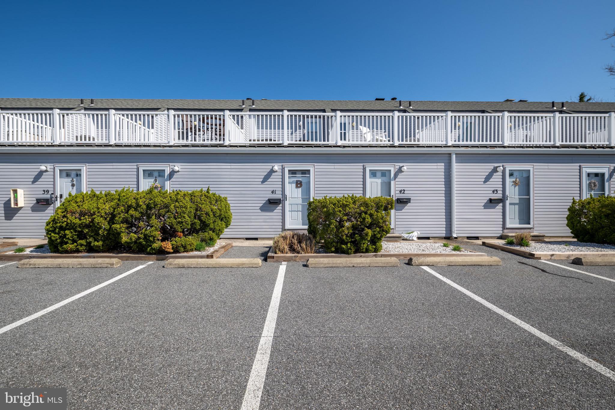 720 Rusty Anchor Road, Unit 41C Ocean City, MD 21842 - Photo 26 of 32 front view of a building with a street