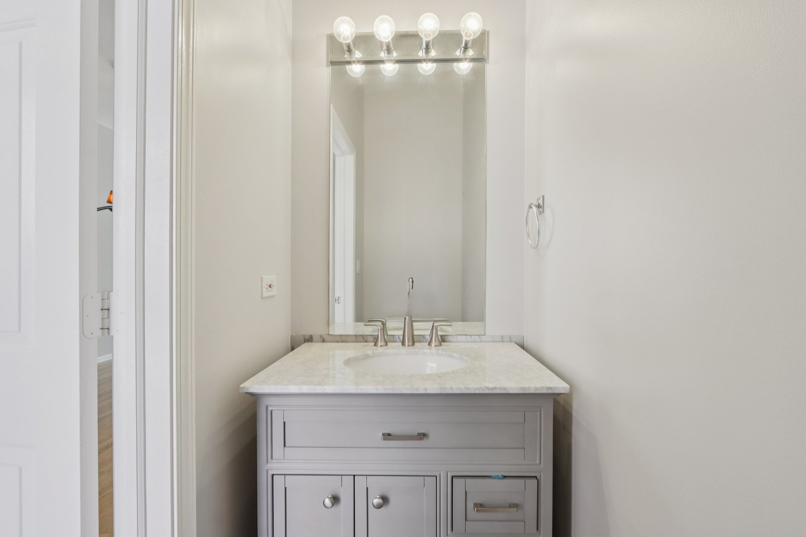 1512 South Halsted Street Chicago, IL 60608 - Photo 12 of 35 a bathroom with a sink and a mirror