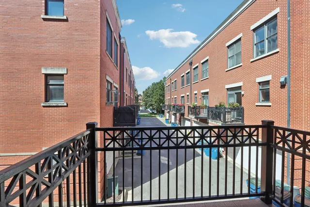 a view of a brick building from a balcony