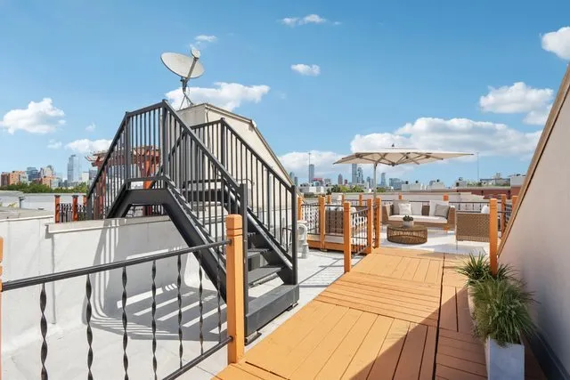 a view of balcony with wooden floor