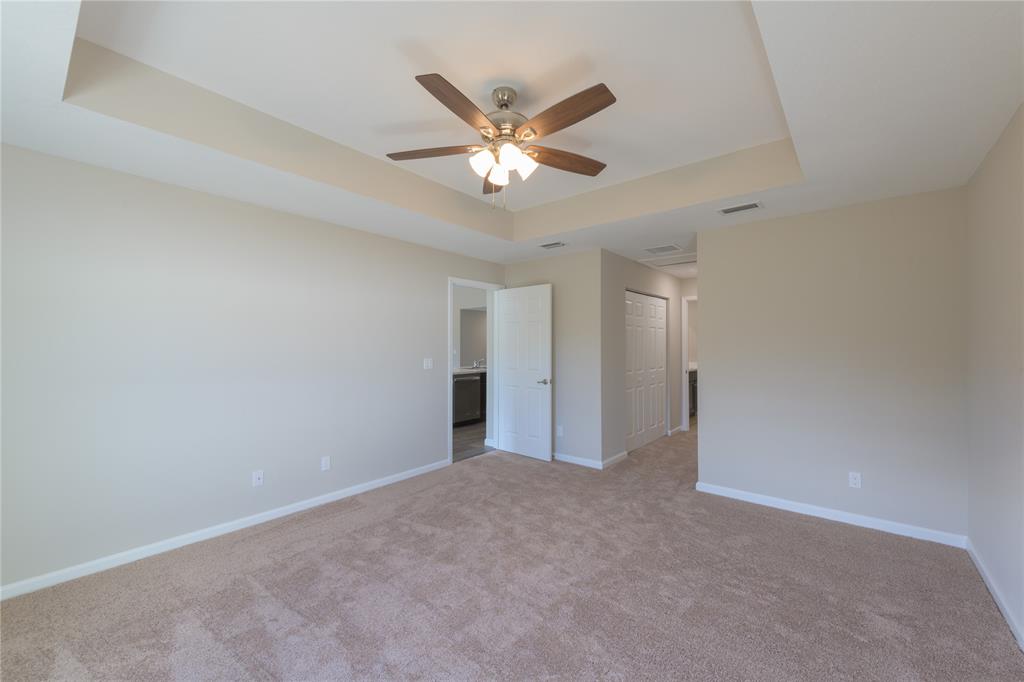 730 Southwest McCall Road Port St. Lucie, FL 34953 - Photo 13 of 28 a view of an empty room with a ceiling fan