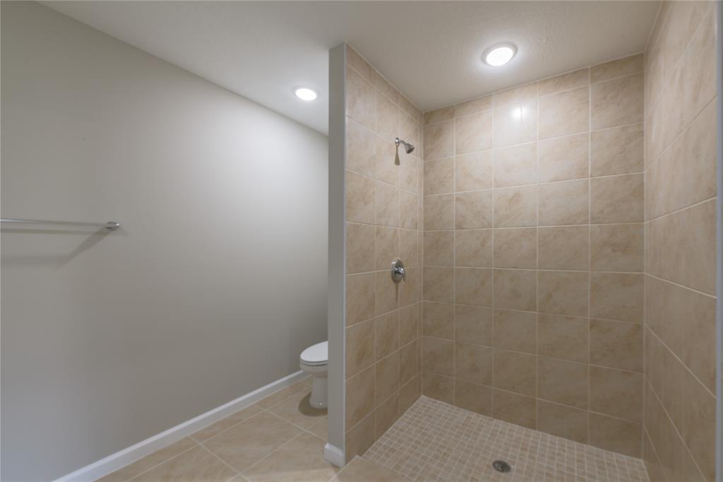 730 Southwest McCall Road Port St. Lucie, FL 34953 - Photo 16 of 28 a bathroom with a shower and toilet