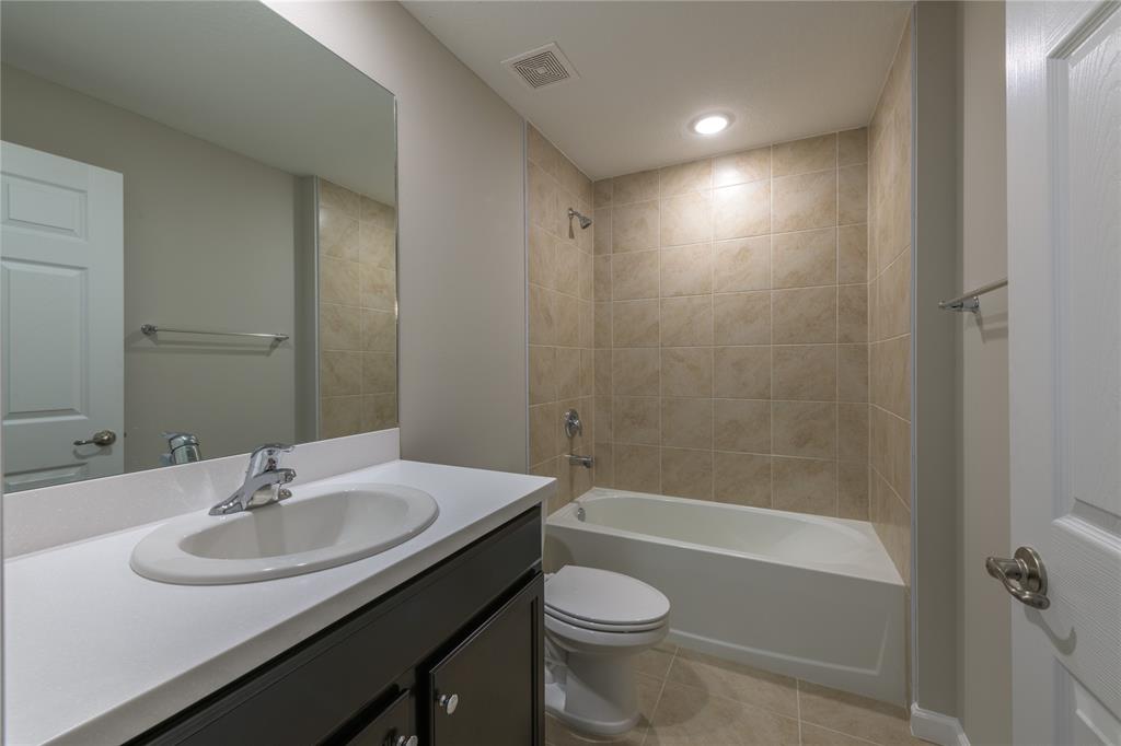 730 Southwest McCall Road Port St. Lucie, FL 34953 - Photo 19 of 28 a bathroom with a sink a toilet and shower