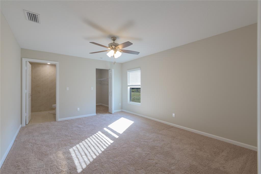 730 Southwest McCall Road Port St. Lucie, FL 34953 - Photo 21 of 28 a view of a big room with windows and chandelier fan