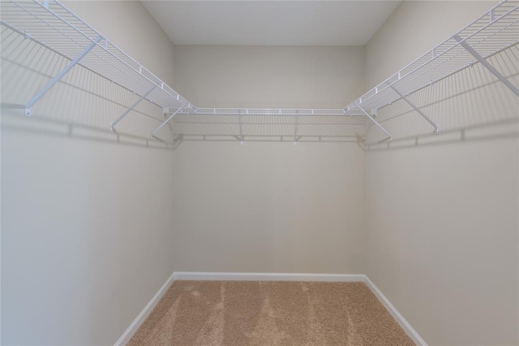 730 Southwest McCall Road Port St. Lucie, FL 34953 - Photo 24 of 28 a view of a room with racks on the wall