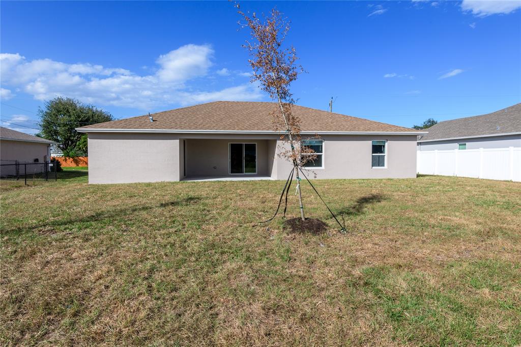 730 Southwest McCall Road Port St. Lucie, FL 34953 - Photo 27 of 28 a house view with a backyard space