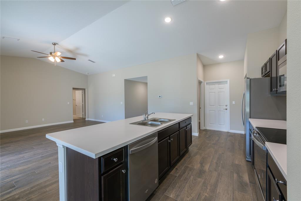 730 Southwest McCall Road Port St. Lucie, FL 34953 - Photo 10 of 28 a kitchen with a stove a refrigerator and a stove