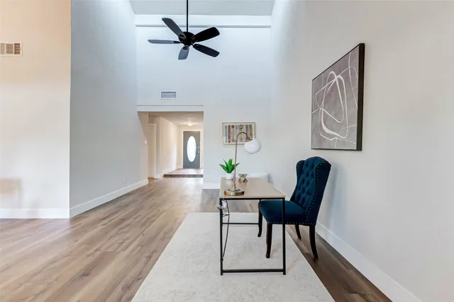 a view of a livingroom with furniture and a window