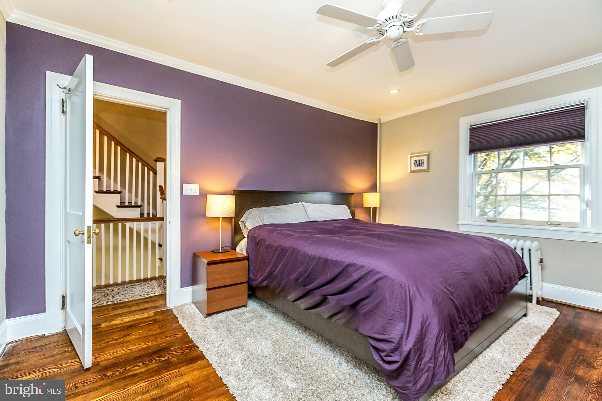 4223 Wickford Road Baltimore, MD 21210 - Photo 14 of 36 a bedroom with a bed and window