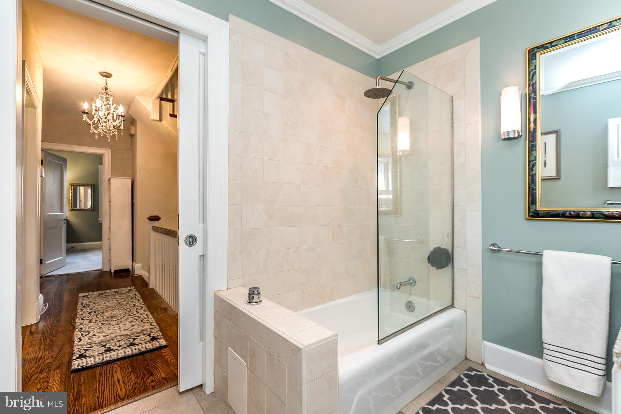 4223 Wickford Road Baltimore, MD 21210 - Photo 23 of 36 a bathroom with a tub shower and sink