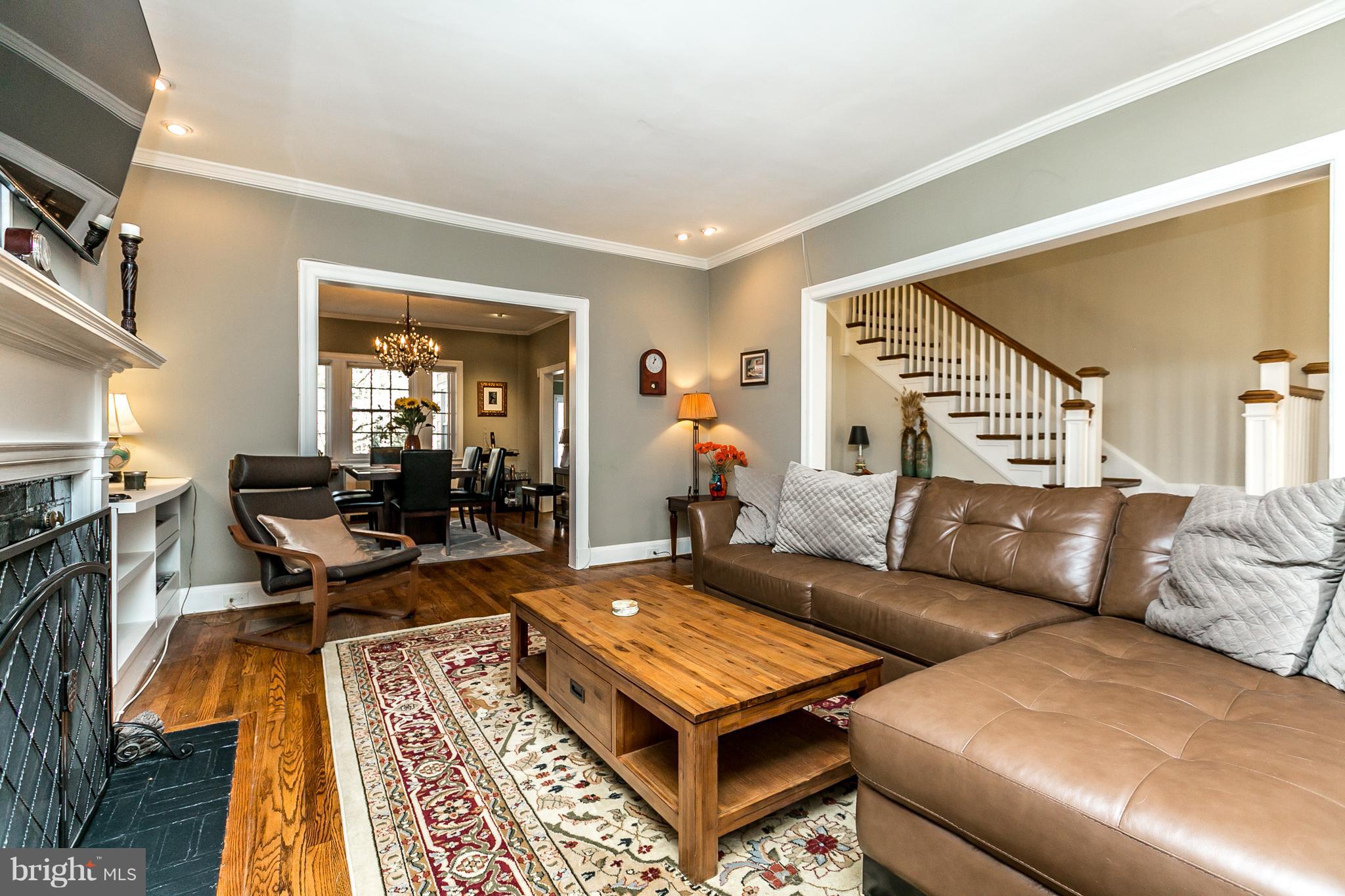 4223 Wickford Road Baltimore, MD 21210 - Photo 4 of 36 a living room with furniture a rug and a table