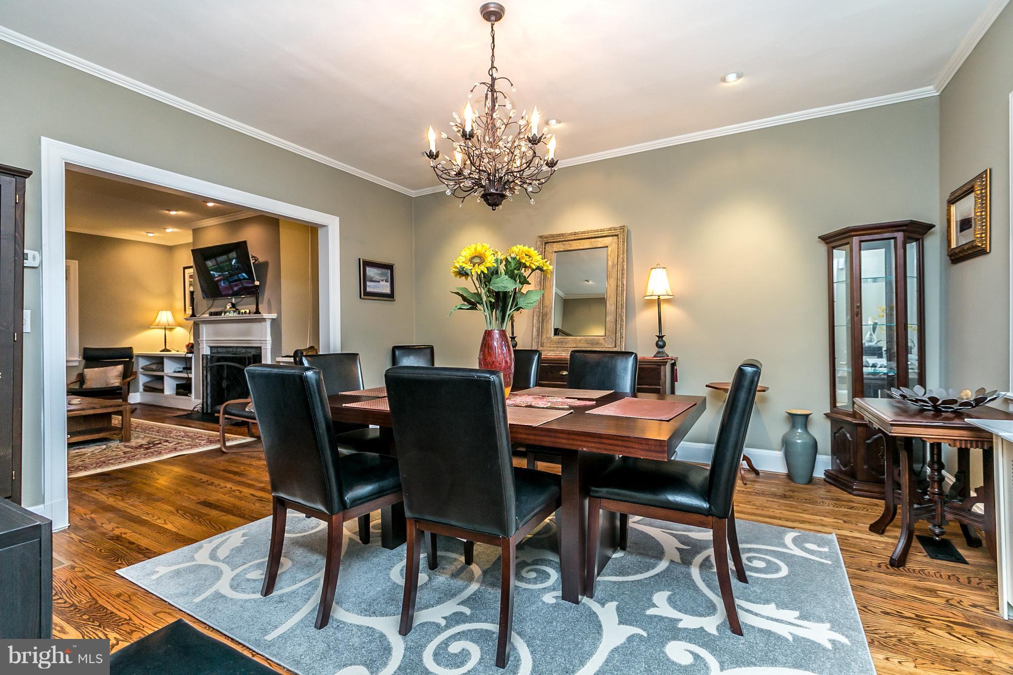 4223 Wickford Road Baltimore, MD 21210 - Photo 7 of 36 a view of a dining room with furniture and a chandelier