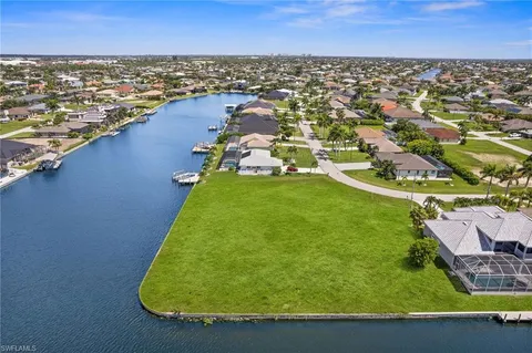 an aerial view of a house with a ocean view