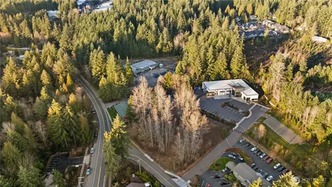 an aerial view of multiple houses with yard