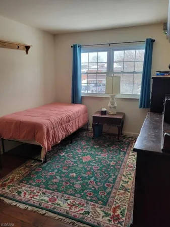 a bed room with a bed and a window