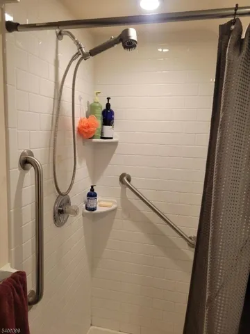 a bathroom with a shower and a shower