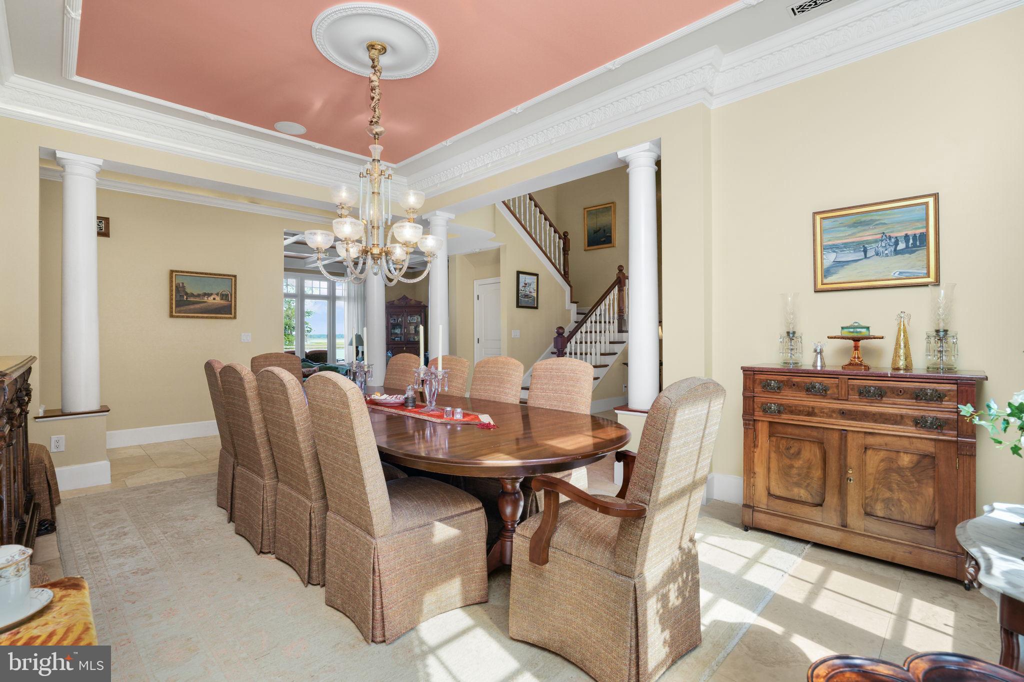 6513 Hampton Road Berlin, MD 21811 - Photo 18 of 129 a dining room with chandelier and wooden floor