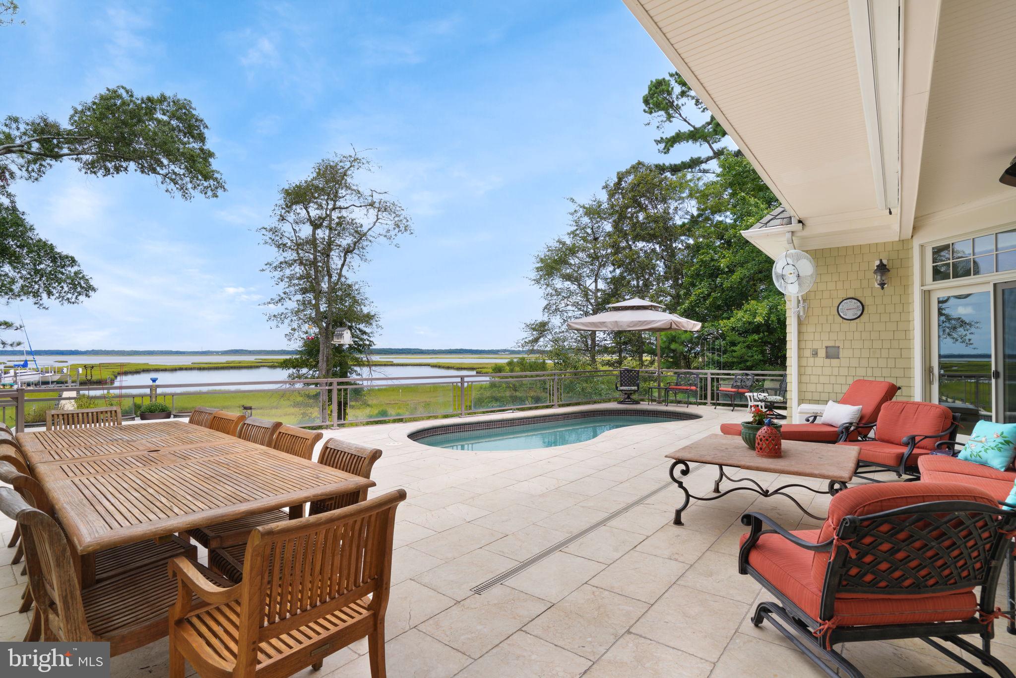 6513 Hampton Road Berlin, MD 21811 - Photo 2 of 129 Marble patio with salt water pool